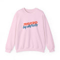 Pink sweatshirt with 'TRIGGERED BY DEFICITS' text on a white background